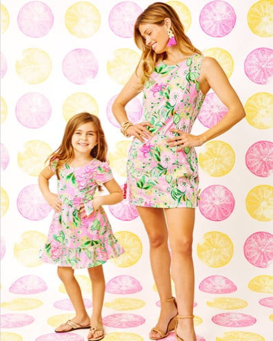 models wearing pink and green and yellow dresses