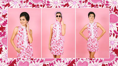 model wearing green and red print dress