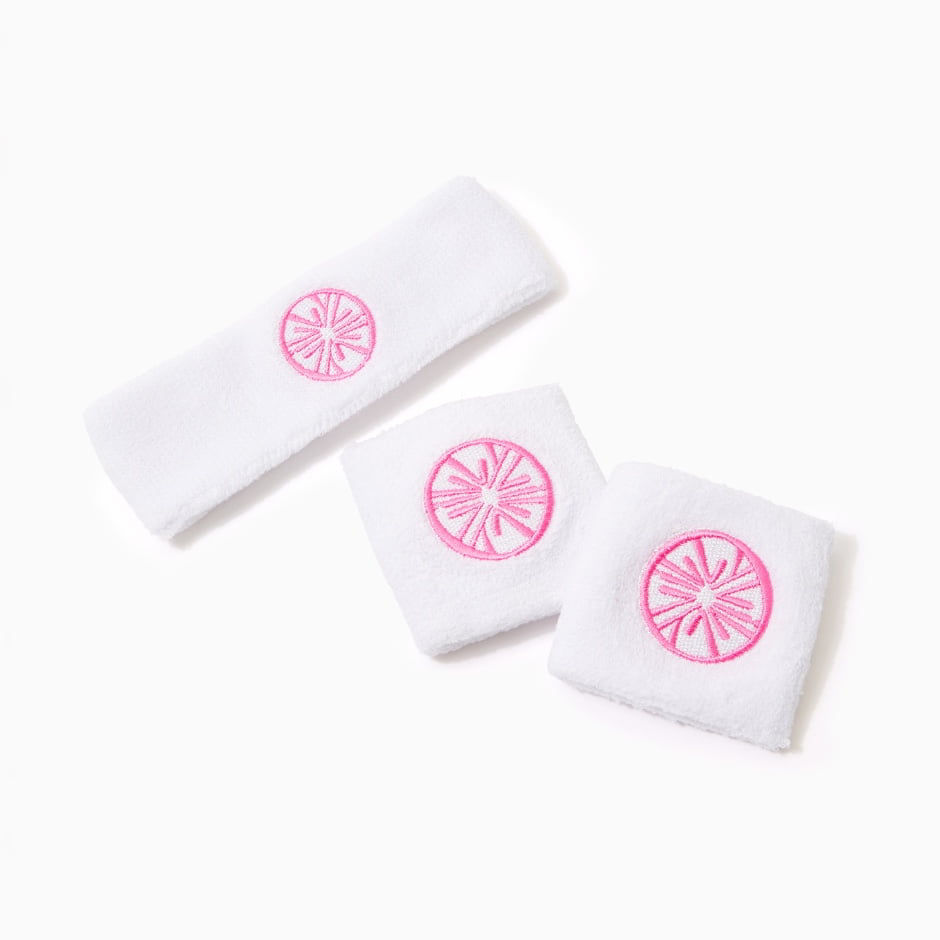 white sweatbands with pink logo