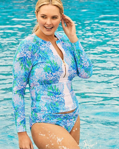 model wearing blue and green printed swimsuit