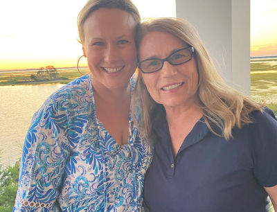 Taylor Black wearing Lilly holding her baby