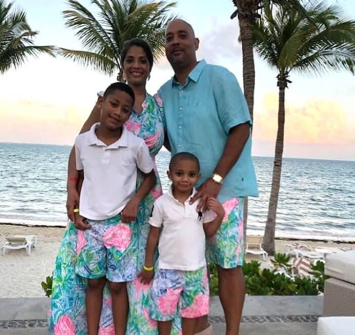 Tosha Willams and her family smiling wearing Lilly prints