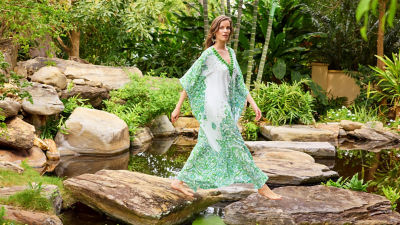 model wearing green printed dress