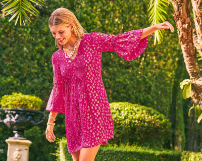 model wearing pink printed dress