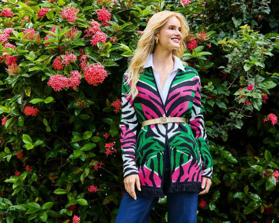 model in pink and green zebra print