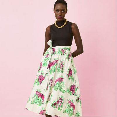 model in black pink and green dress