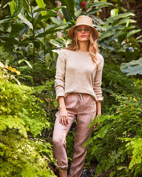 model wearing tan sweater and linen pants