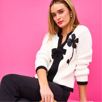 model in black and white sweater