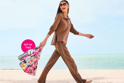 Model smiling carrying her reusable printed bag