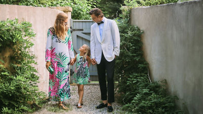 model wearing green and red print dress