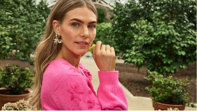 model wearing purple swimsuits