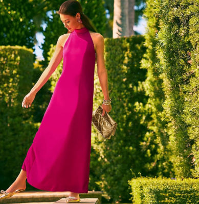 Woman wearing a long dark pink dress