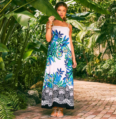 Woman wearing a white and blue engineer printed maxi dress