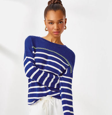 Woman wearing a blue and white striped sweater