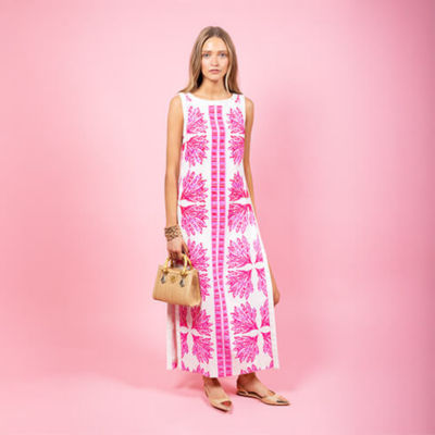 Woman wearing a white and pink printed maxi shift romper