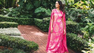 Woman wearing a pink and gold metallic maxi caftan