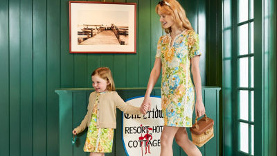 Woman and little girl wearing printed dresses