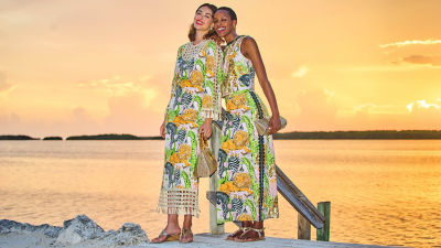 Women wearing printed dresses