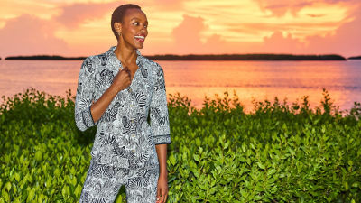 Woman wearing a black and white printed top and pants