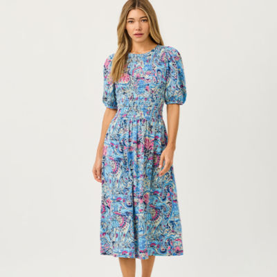 Women wearing a long blue printed dress