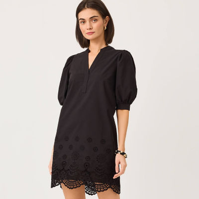 Women wearing a black short dress