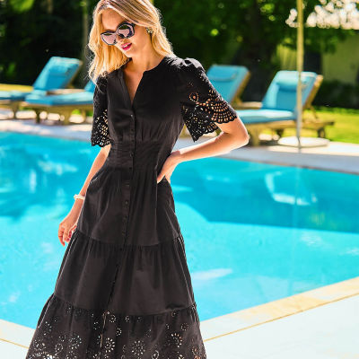 Women wearing a long black dress
