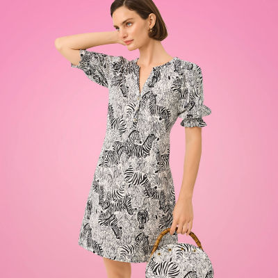 Woman wearing a black and white printed dress