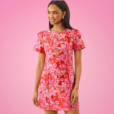 Woman wearing a pink printed dress