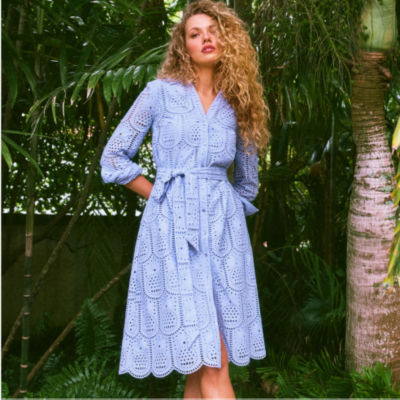 Woman wearing a purple eyelet midi dress