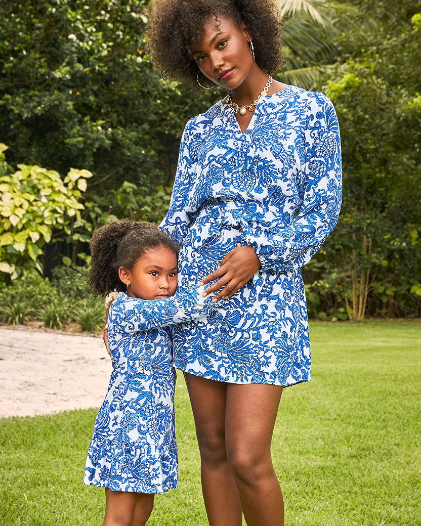Mother and daughter wearing matching dresses in the Deeper Coconut Ride With Me print
