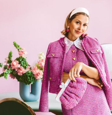 Woman wearing a pink boucle outfit