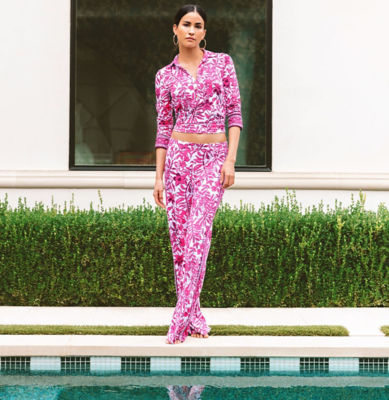 Woman wearing a pink and white printed top and matching pants