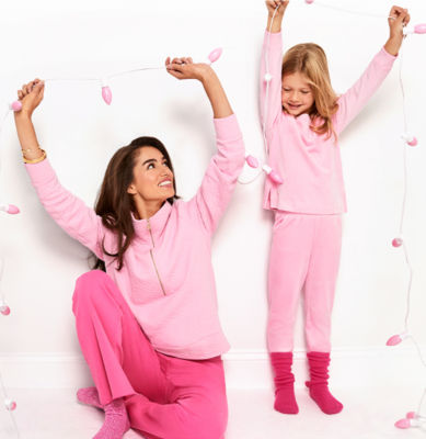 Woman and little girl wearing matching pink loungewear