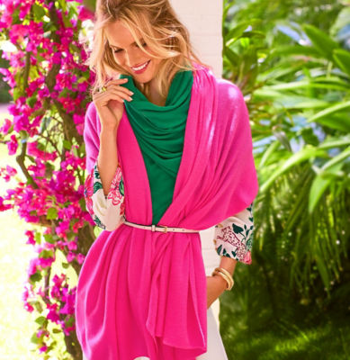 Woman wearing a pink cashmere sweater wrap