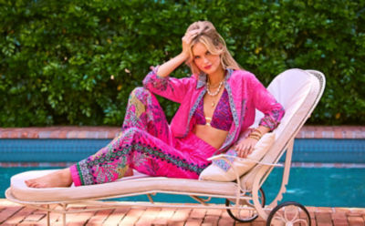 Woman wearing a pink printed top and matching pants