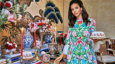 Woman wearing a green printed romper