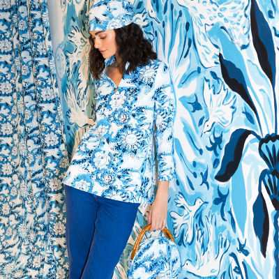 Woman wearing a blue and white printed tunic