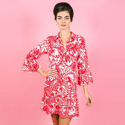 Woman wearing a red and white printed dress