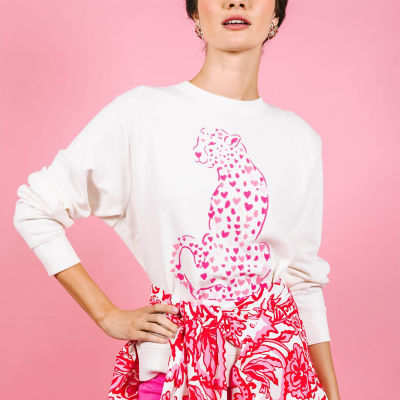 Woman wearing a white sweatshirt with a pink animal