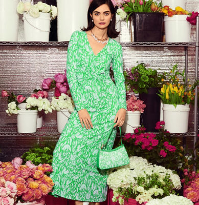 Woman wearing a green and white printed dress