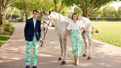Man and woman wearing blue printed outfits