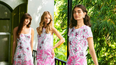 Women wearing a pink and white printed dresses