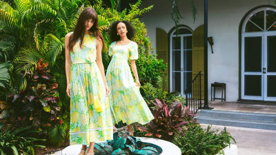 Women wearing green and yellow printed midi dresses