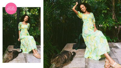 Woman in a green and yellow printed long dress