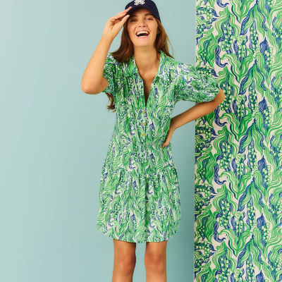 Woman wearing a green printed dress
