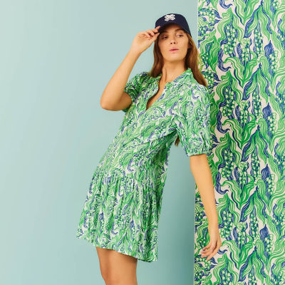 Woman wearing a green printed dress