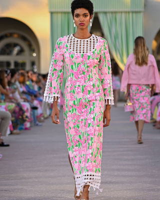 Woman wearing a pink and green maxi dress