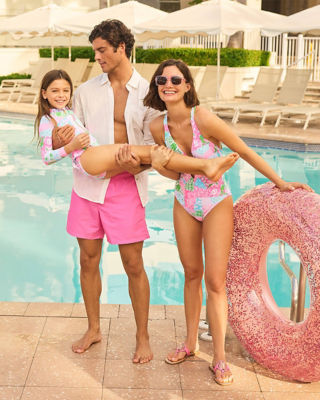 Family wearing coordinating swimsuits