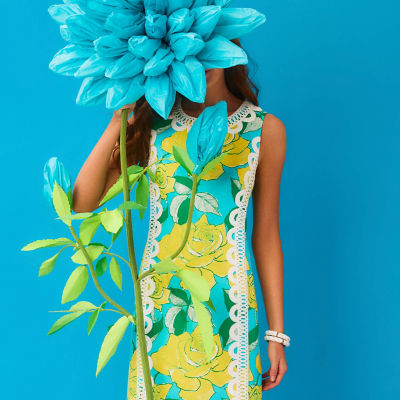 Woman wearing a blue and yellow printed dress