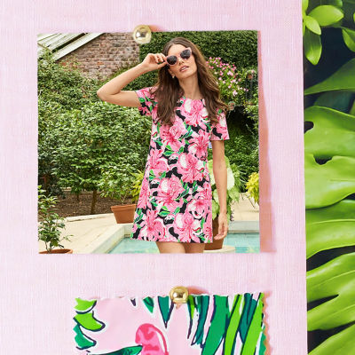 Woman wearing a short pink and black floral printed dress